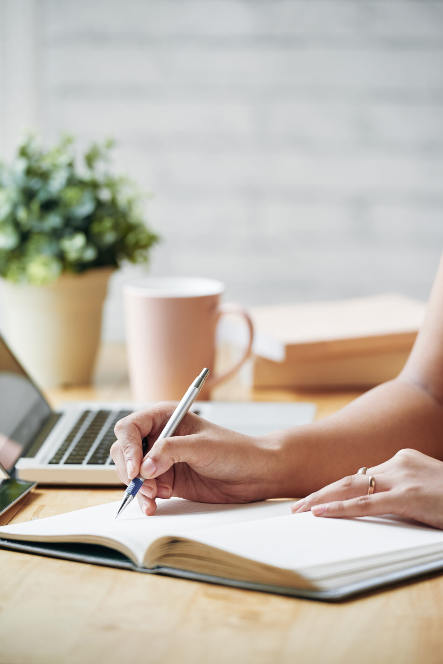 Hands of business lady writing schedule for the upcoming week
